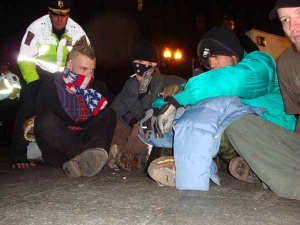 Thirty minutes after the first bout of arrests, Police began arresting a group of five man who planted themselves in the path of a front end loader parked on Atlantic Avenue.